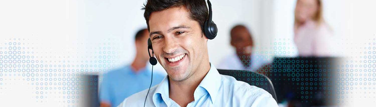a guy giving technical support on call with a smile